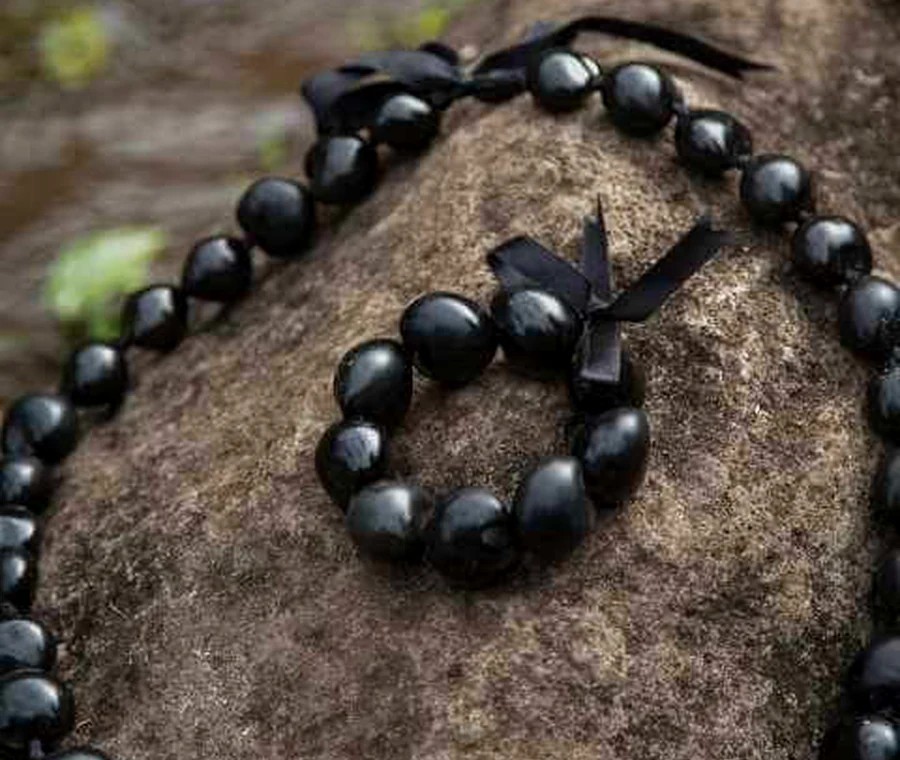 Glossy black kukui nut lei